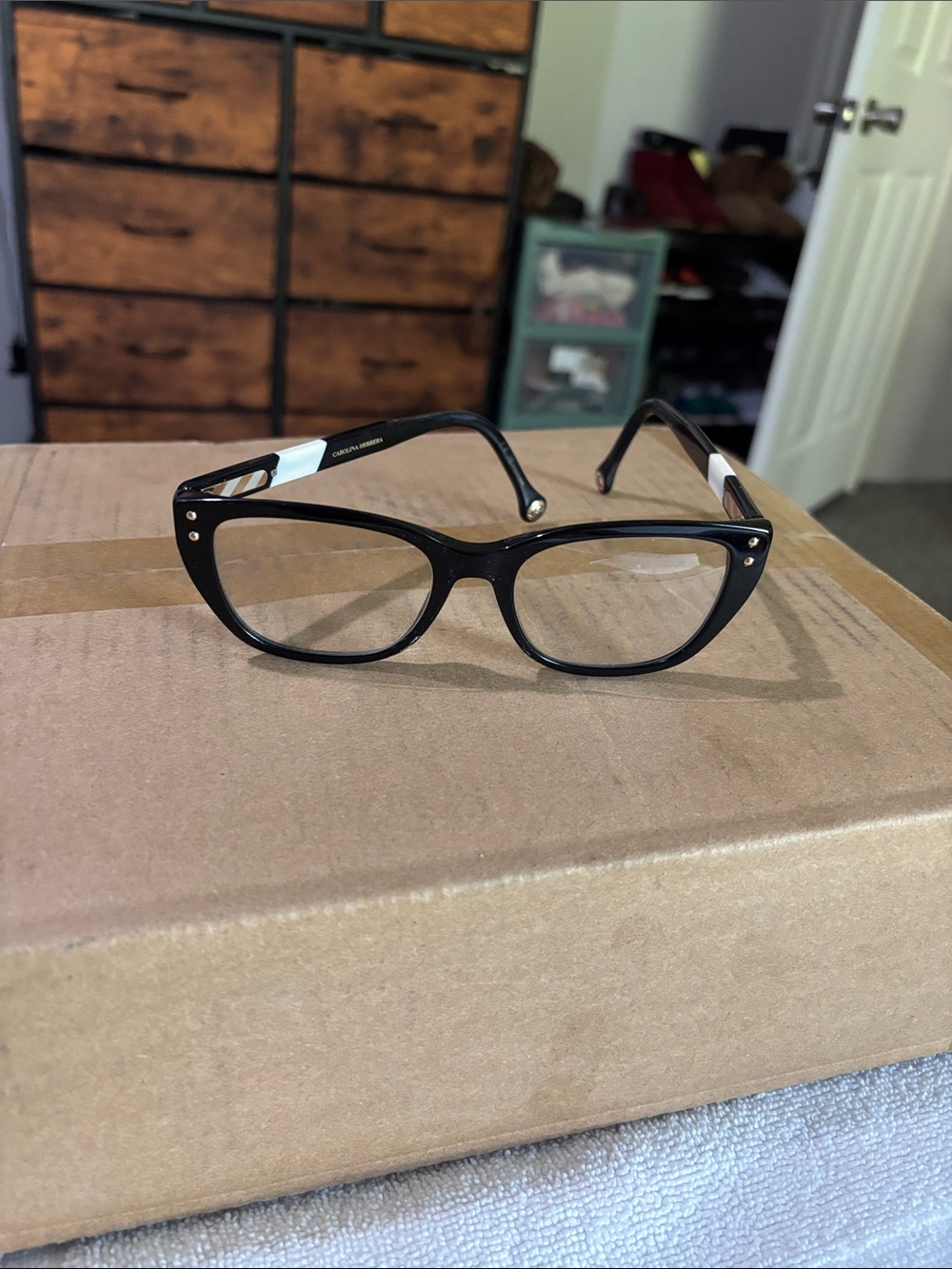 Carolina Herrera Black Cat-Eye Glasses with White Temple Accents